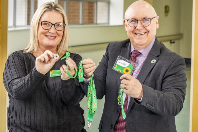 Kerry Flint and Alan Duffell with the lanyards and badges