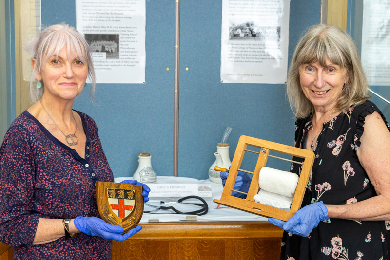 Volunteers Sharron Wise and Helen Steatham with some of the historical healthcare items