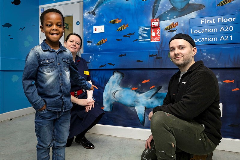 Noah Sessi, aged five, Sarah Lewis, Matron for Children’s Ward and Daniel Russell-Ahern, aka Mr Mural