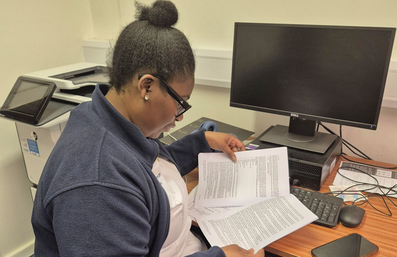 Pascar Mholi at her desk on her placement
