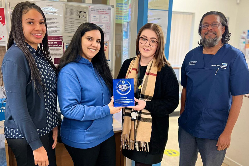 Latest News: alome Edobor, Receptionist, Sonal Kumar, Receptionist, holding the trophy with Hayleigh Griffiths, Branch Manager at Warstones Surgery, and Dr Abdool Koodaruth, GP