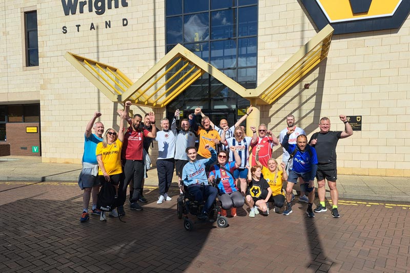 Walkers with Gav, Jason and Jude outside Molineux at the end of their journey