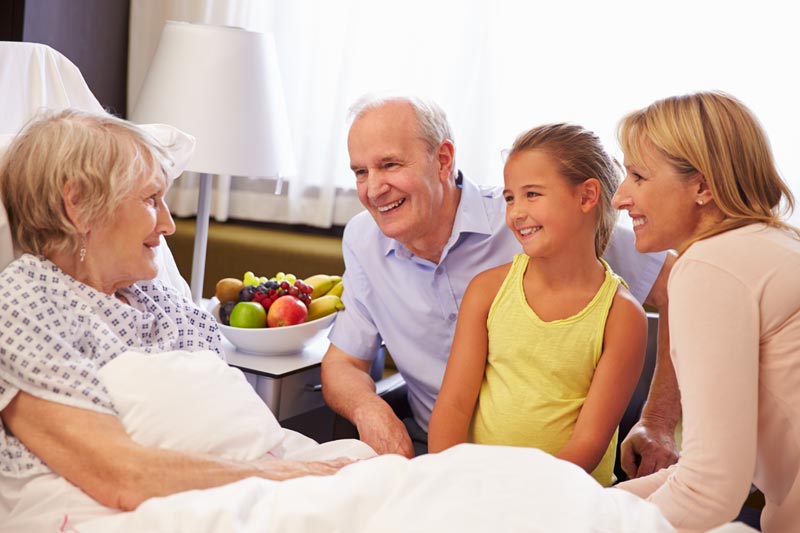 Family visiting grandmother in hospital