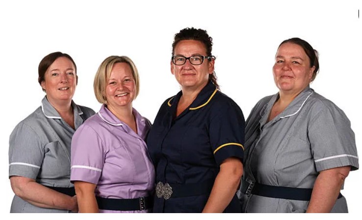 Members of the RWT Learning and Disability Team smiling and standing together, signifying support and collaboration