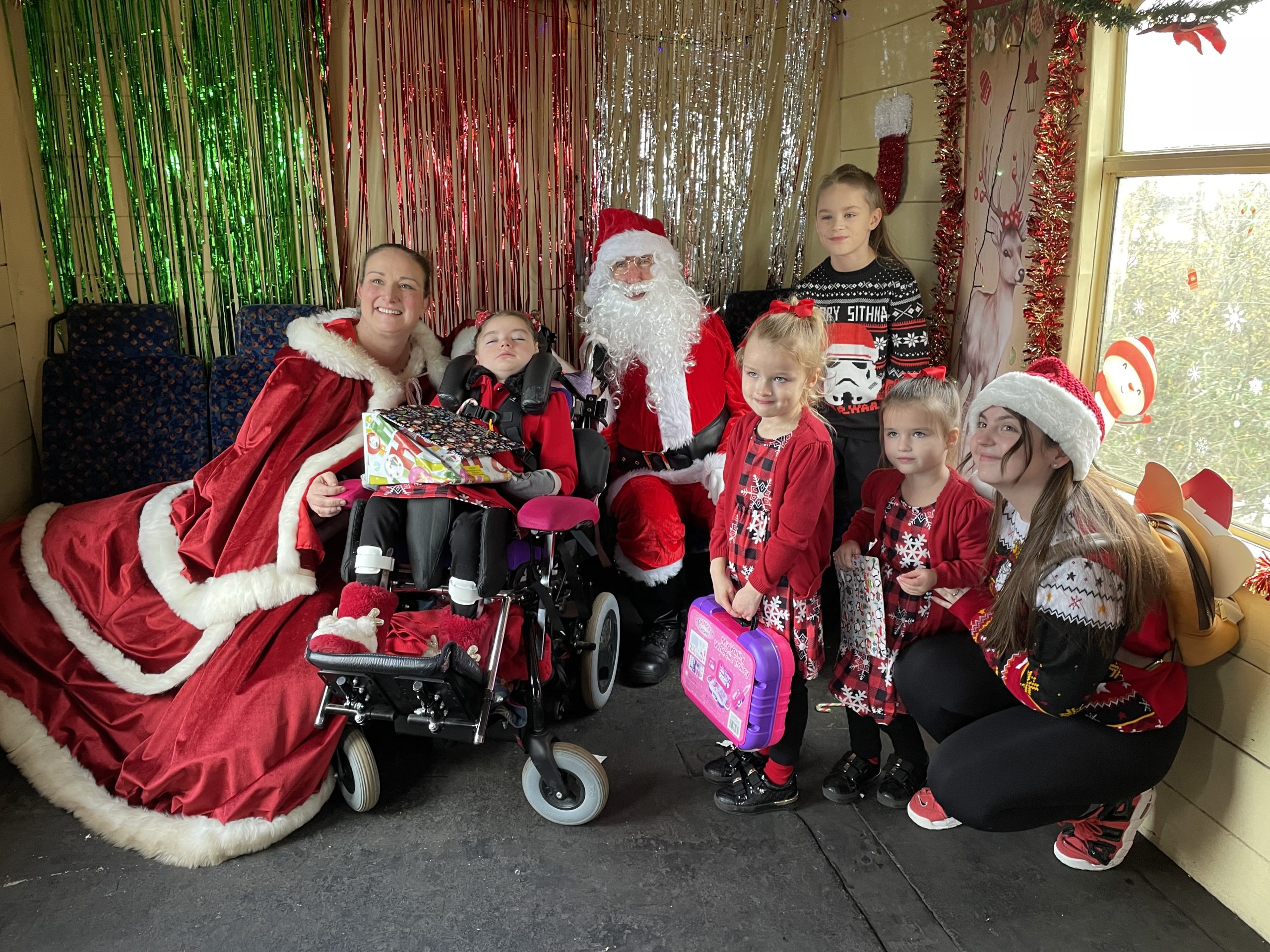Verity (pictured second from left) and her family enjoy the Santa train.